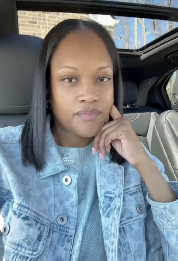 woman sitting in her car